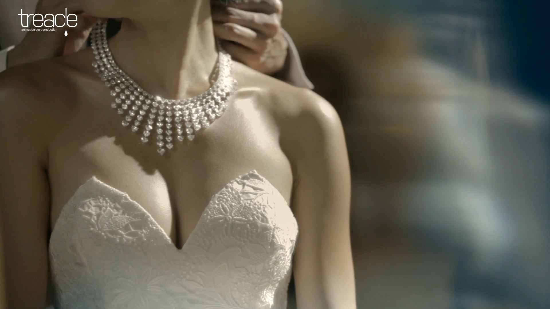 A bride wears an elegant diamond necklace