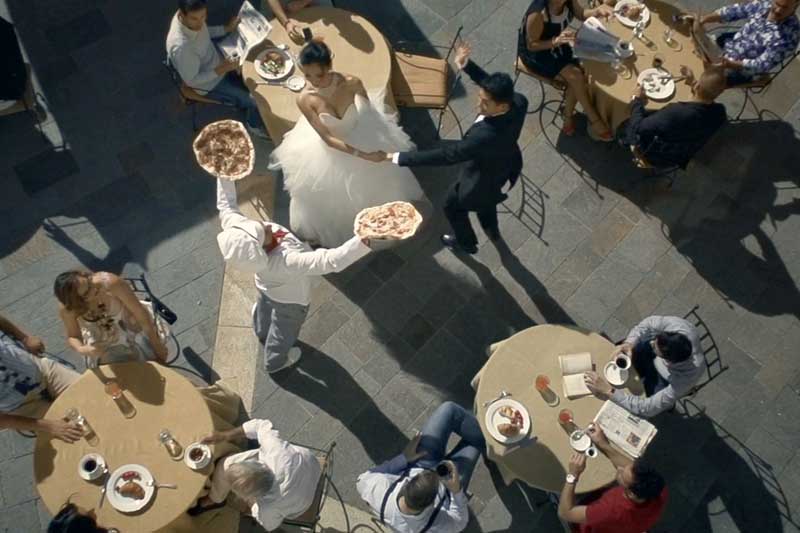 A cafe where people are having meal and enjoying dancing